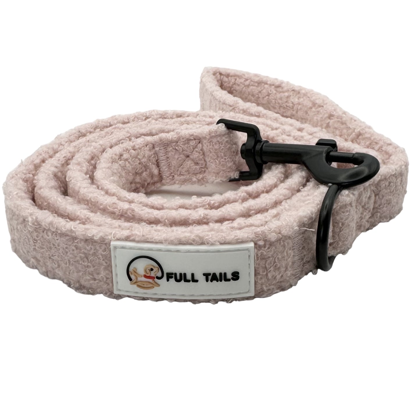 A pink teddy-textured dog leash with a black padded handle and a metal clasp, featuring the brand label 'FULL TAILS'.