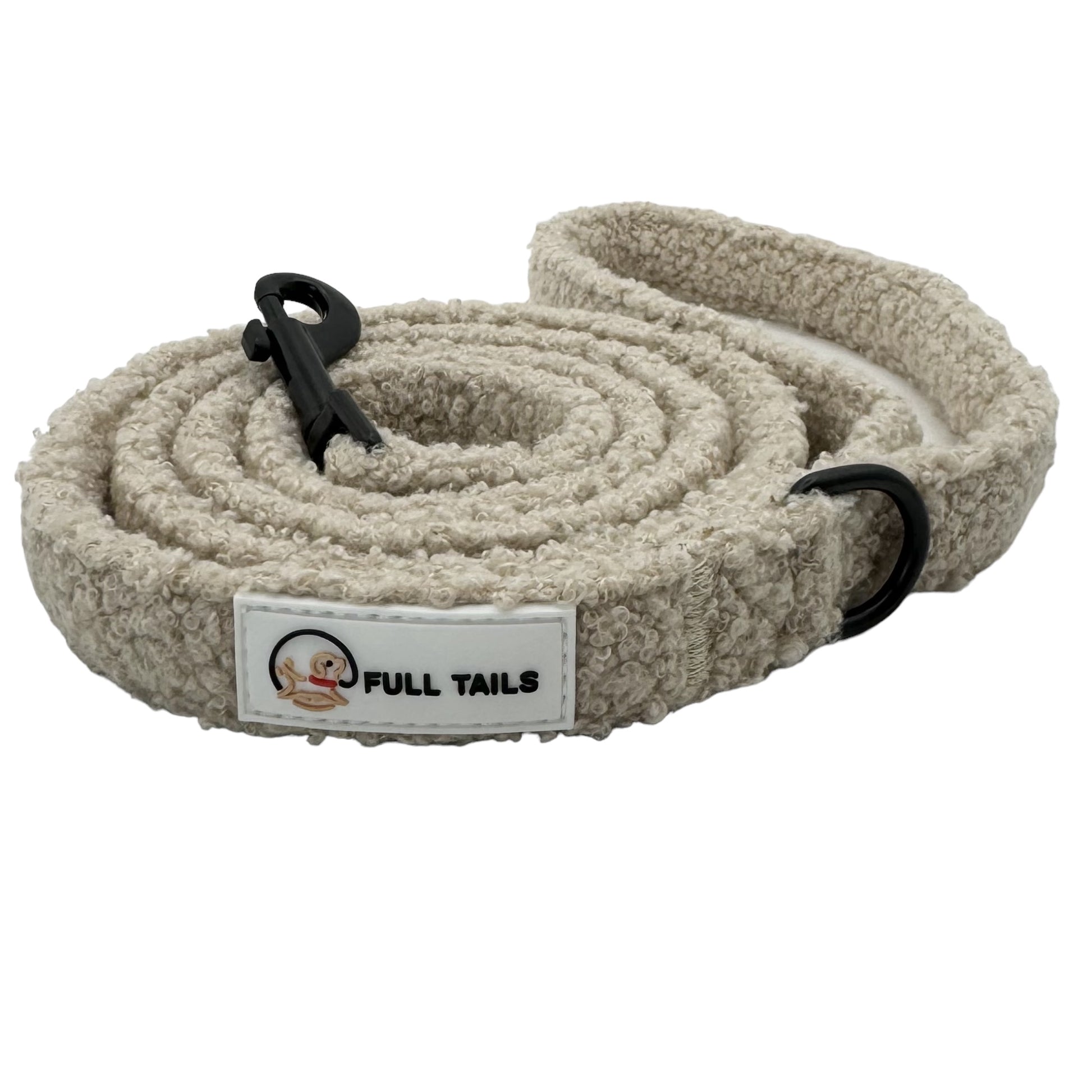 A beige teddy-textured dog leash with a padded handle and a metal clasp, featuring the brand label 'FULL TAILS' on a white label.