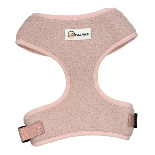 A pink adjustable neck harness for dogs with a brand label visible on the product.