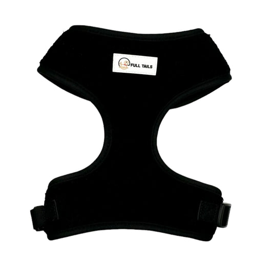 Black adjustable neck harness for dogs with a brand label on the top center.